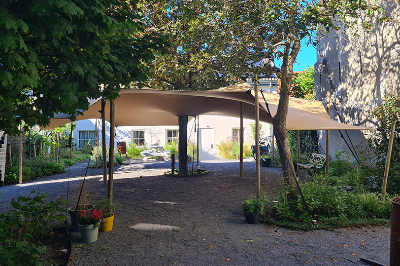 6.5m x 10m Hiflexx Stretch Tent in courtyard
